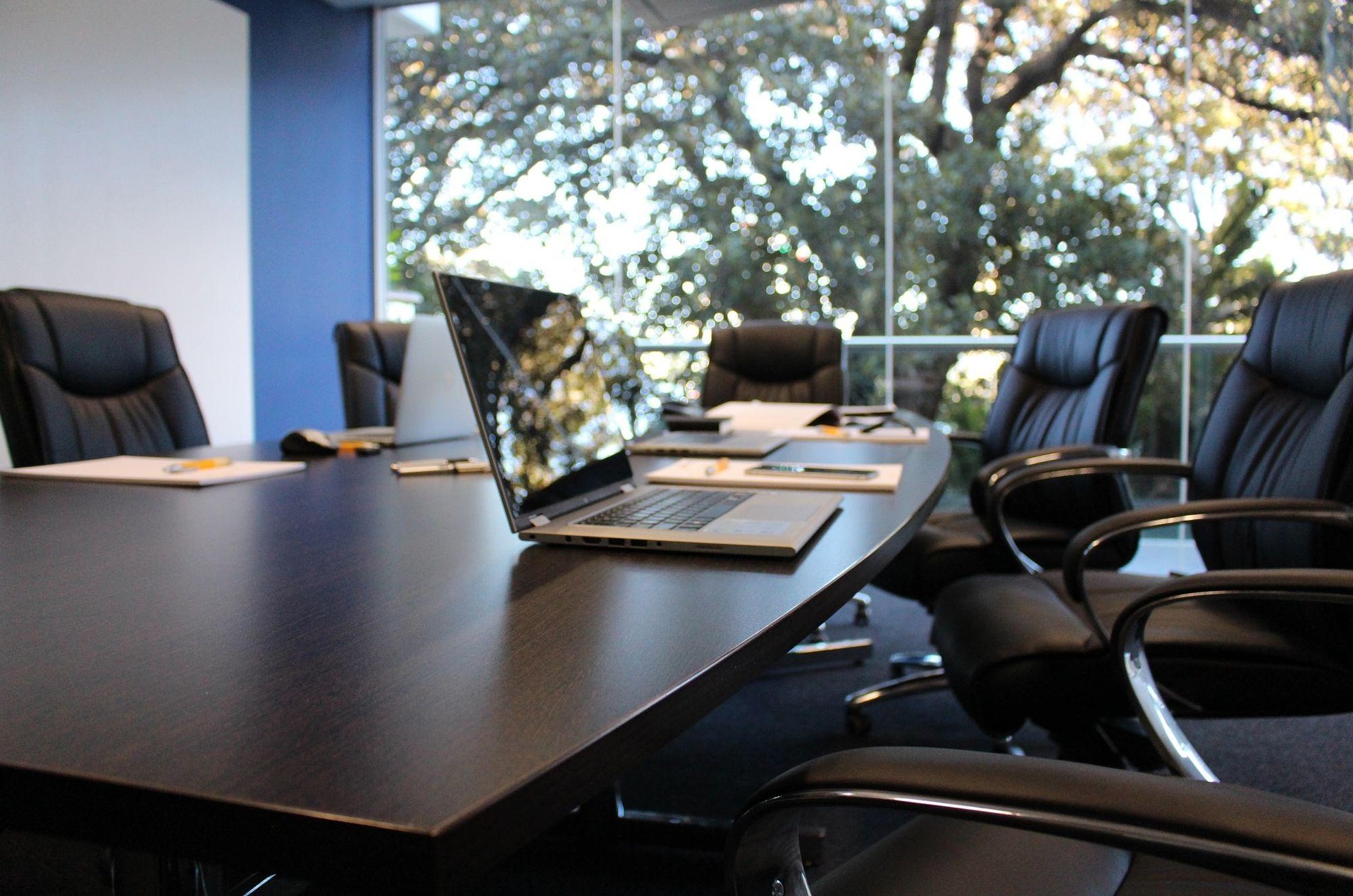 Investment and finance — professional boardroom with executives reviewing financial data and investment portfolios